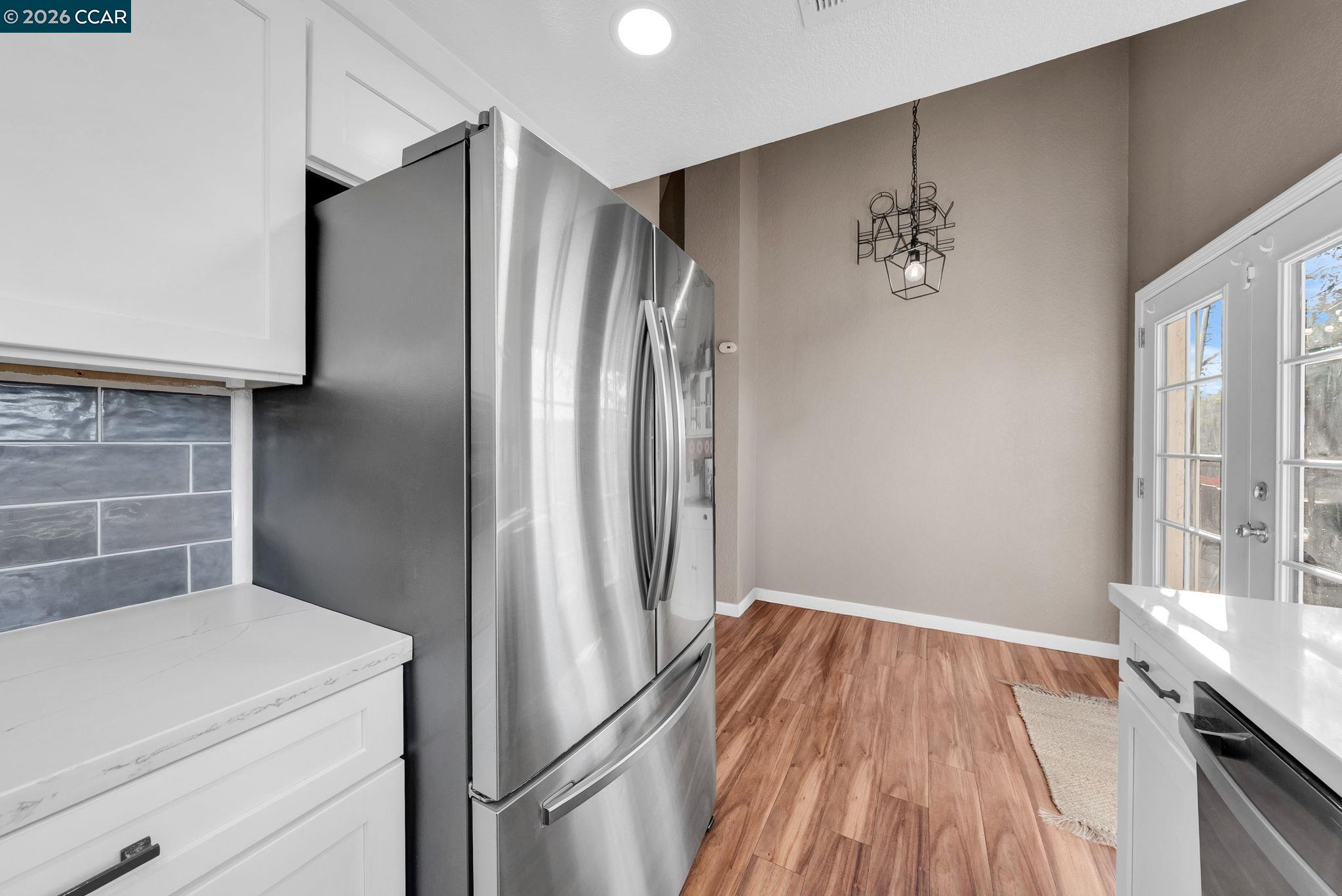 232 Case Drive Pittsburg, CA 94565 - Photo 6 of 37 a kitchen with a refrigerator and countertop in it