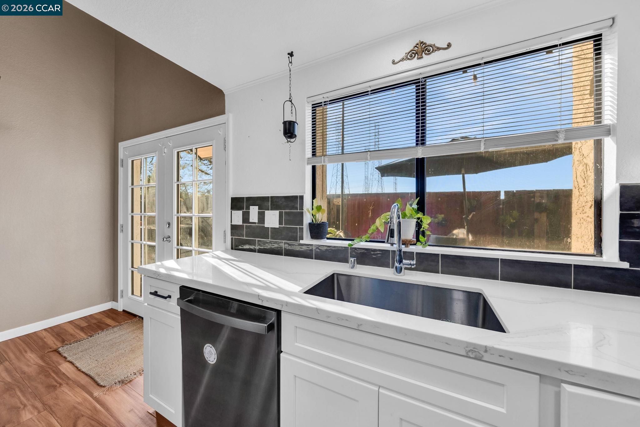 232 Case Drive Pittsburg, CA 94565 - Photo 8 of 37 a kitchen with stainless steel appliances a sink and cabinets