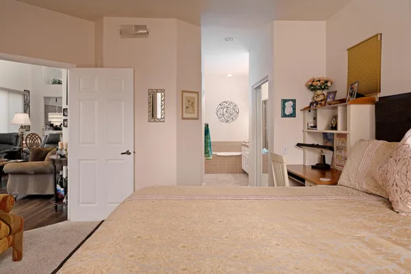 a bedroom with a bed and a cabinets