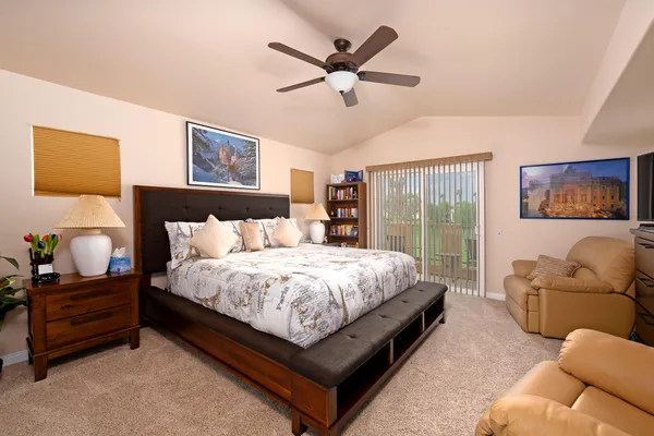 a bedroom with a bed and window