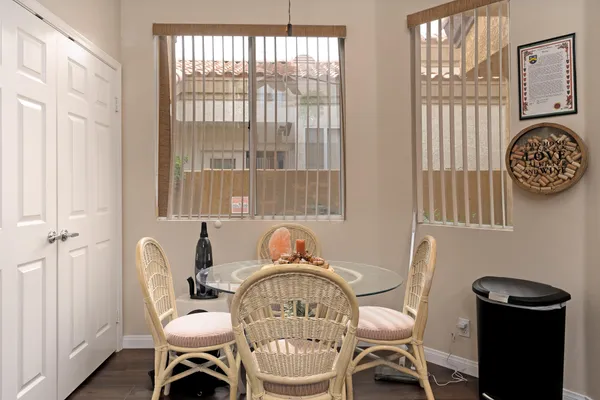 a view of a dining room with furniture and chandelier