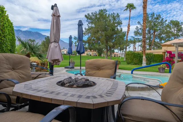 a view of a table and chairs in the patio