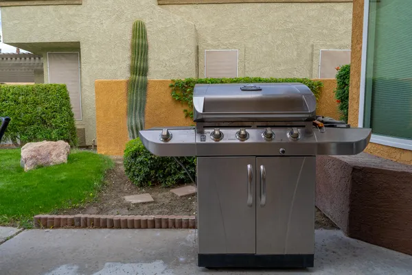 a view of barbeque area with stove