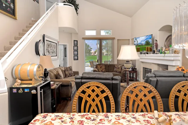 a living room with furniture a fireplace and decor