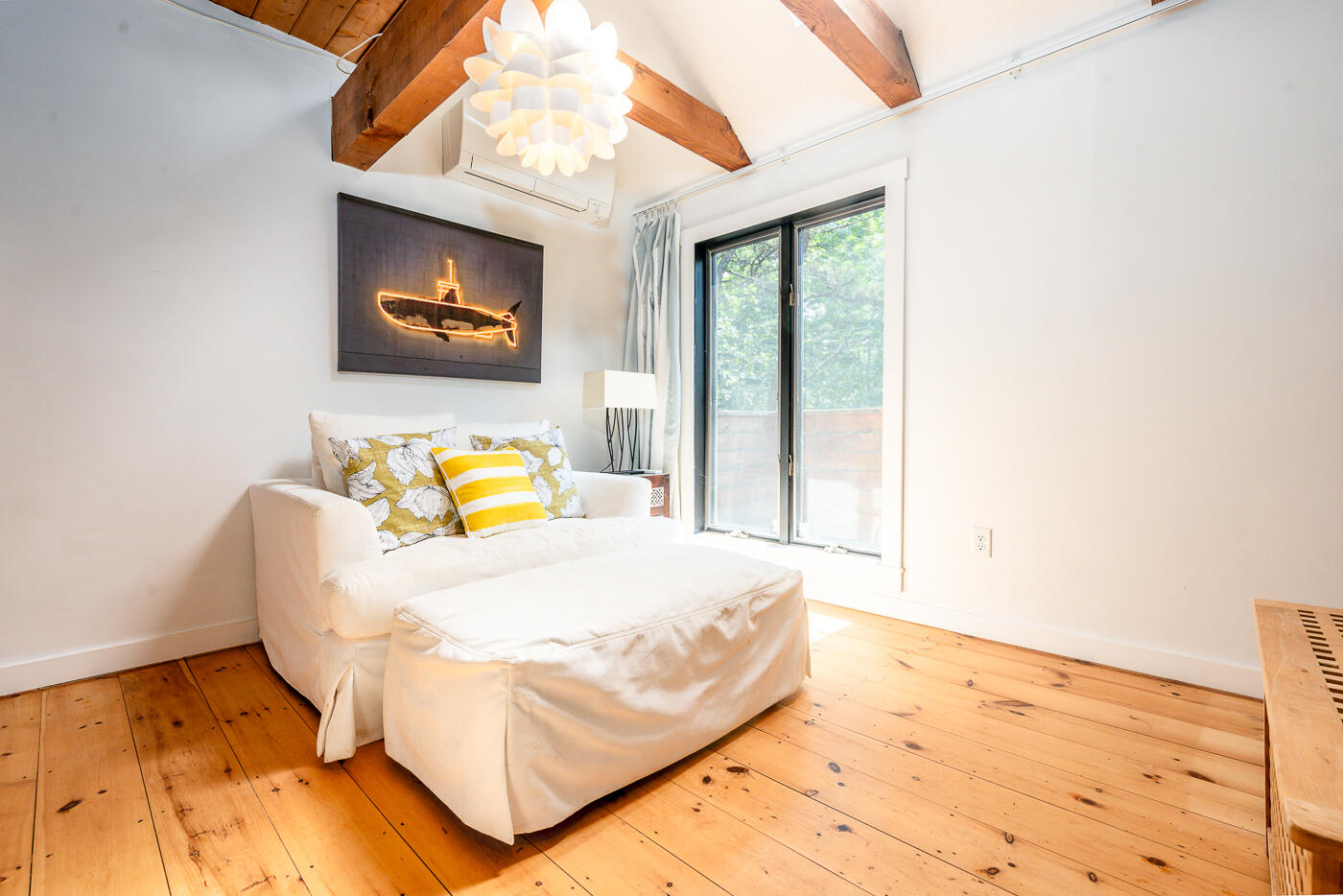 215 Gull Pond Road Wellfleet, MA 02667 - Photo 11 of 47 a bed sitting in a bedroom next to a window