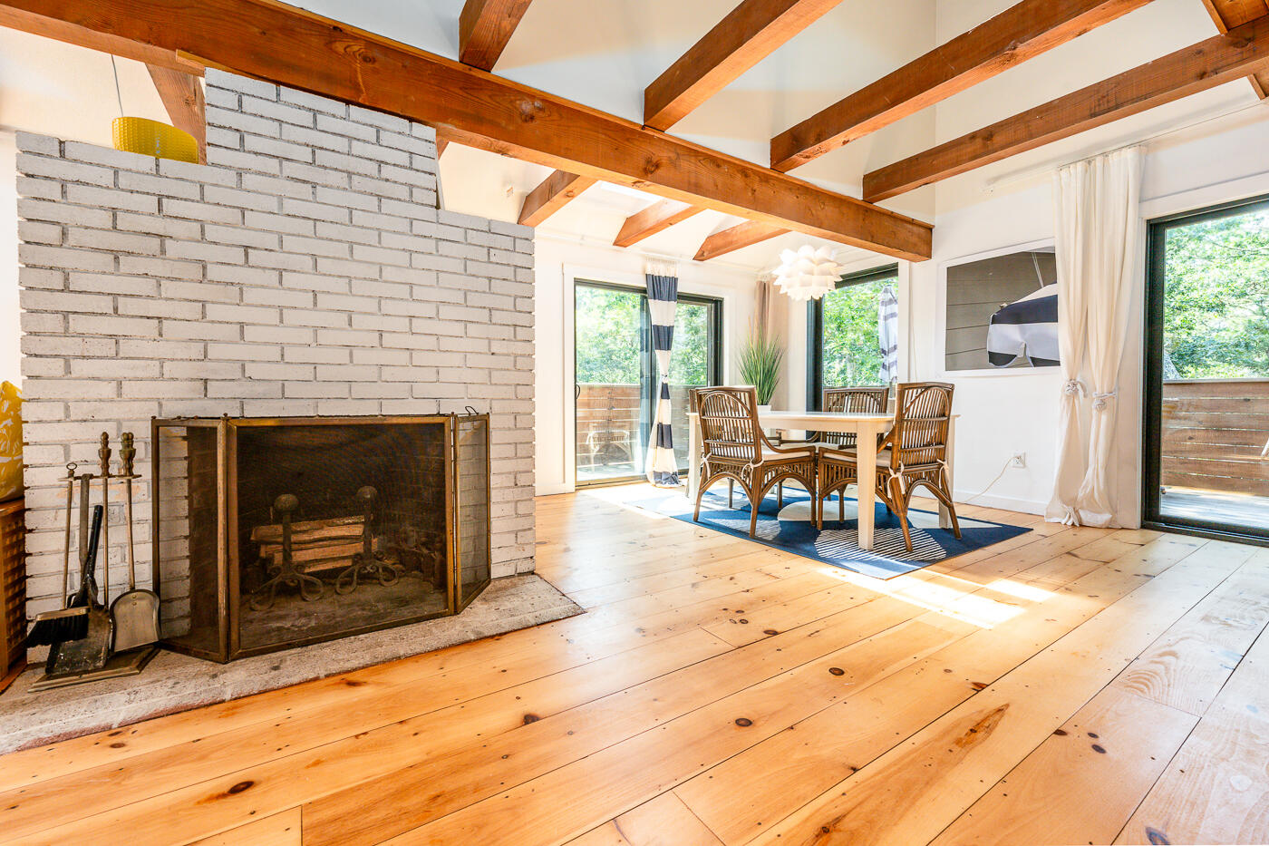 215 Gull Pond Road Wellfleet, MA 02667 - Photo 12 of 47 a living room with furniture and a fireplace