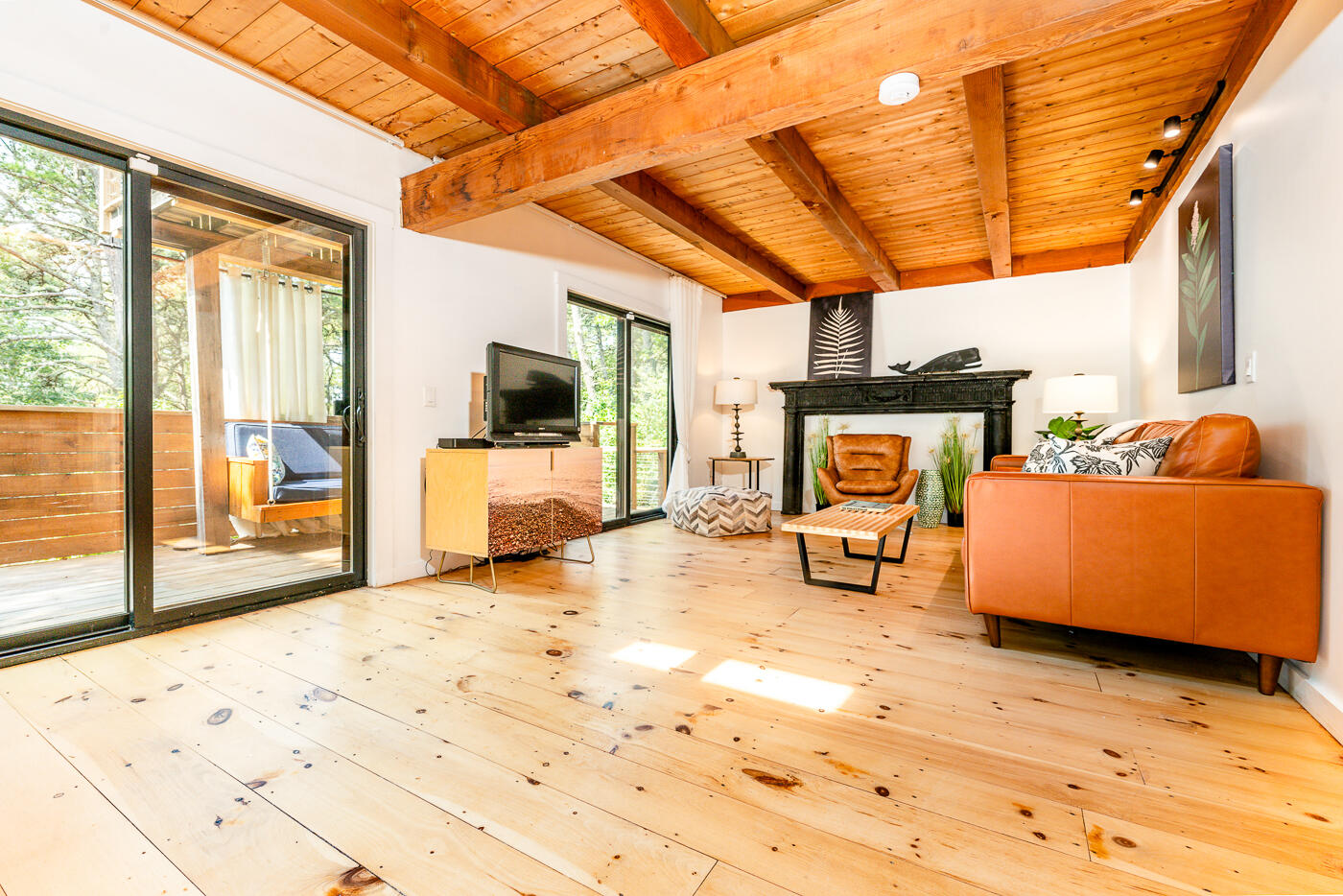 215 Gull Pond Road Wellfleet, MA 02667 - Photo 15 of 47 a bedroom with furniture and a flat screen tv