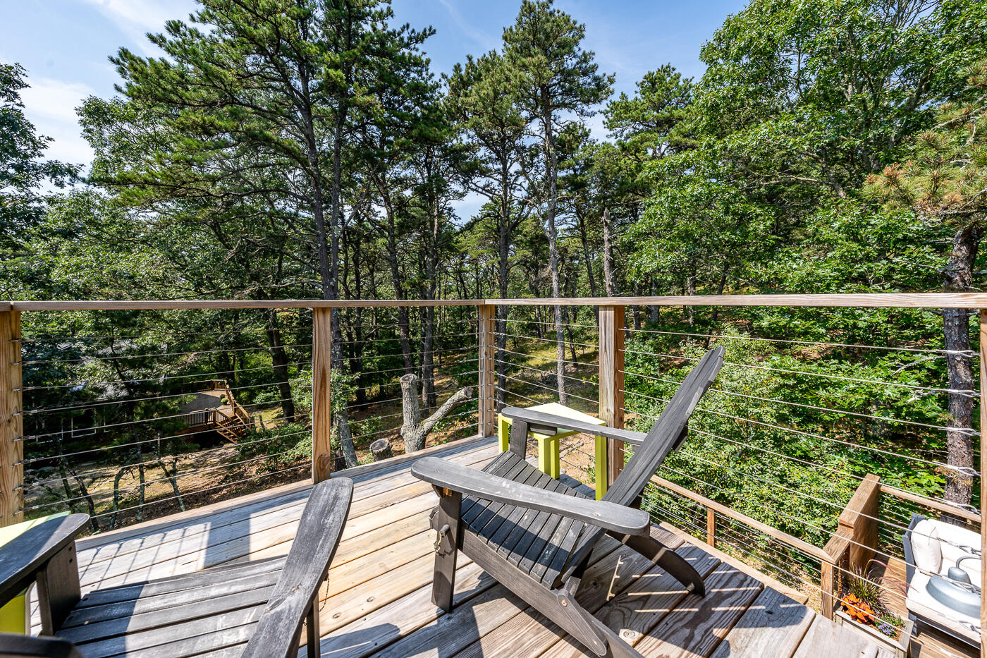 215 Gull Pond Road Wellfleet, MA 02667 - Photo 22 of 47 a view of a balcony with wooden floor and outdoor seating