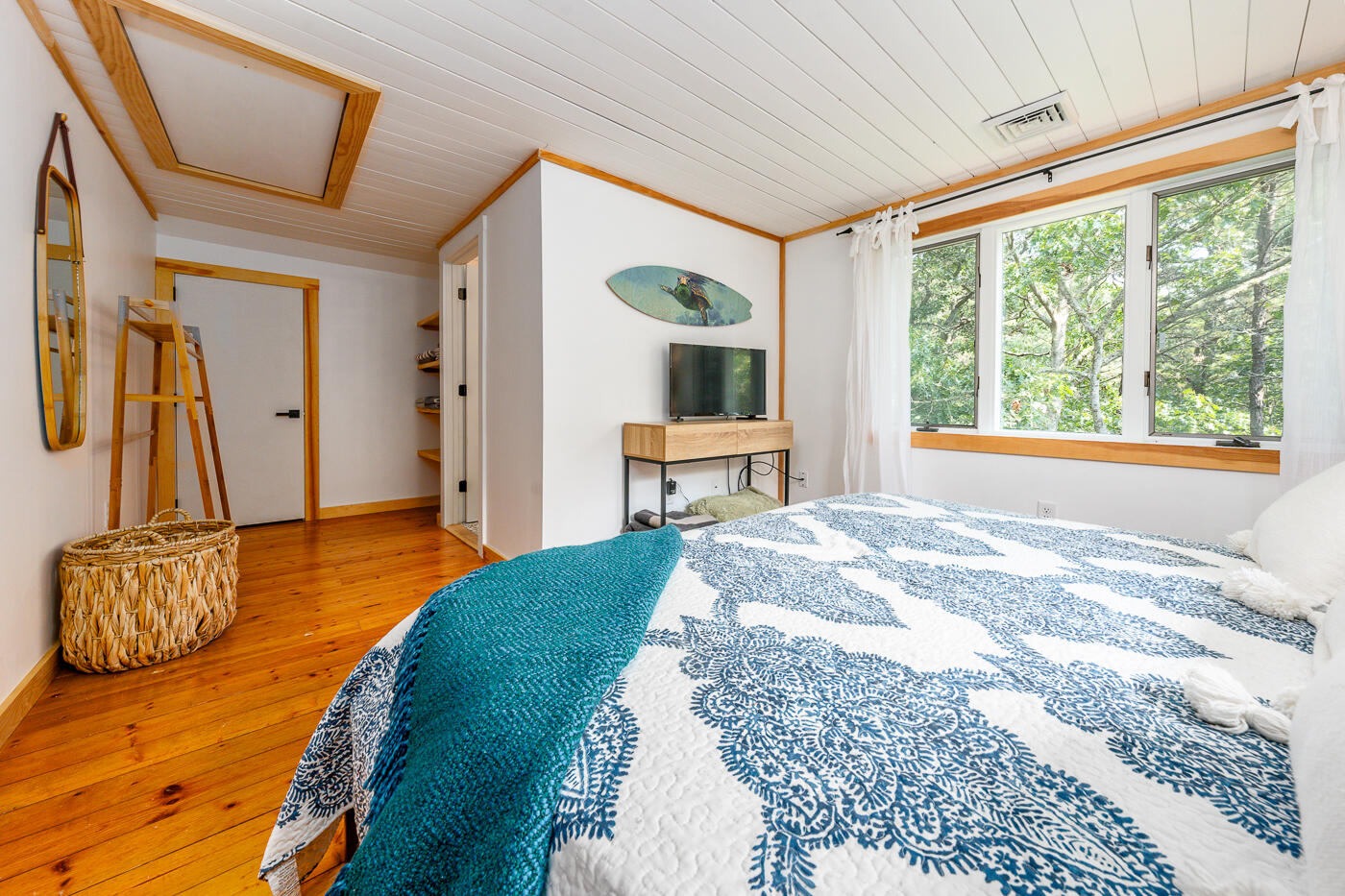 215 Gull Pond Road Wellfleet, MA 02667 - Photo 24 of 47 a bedroom with a bed and a large window