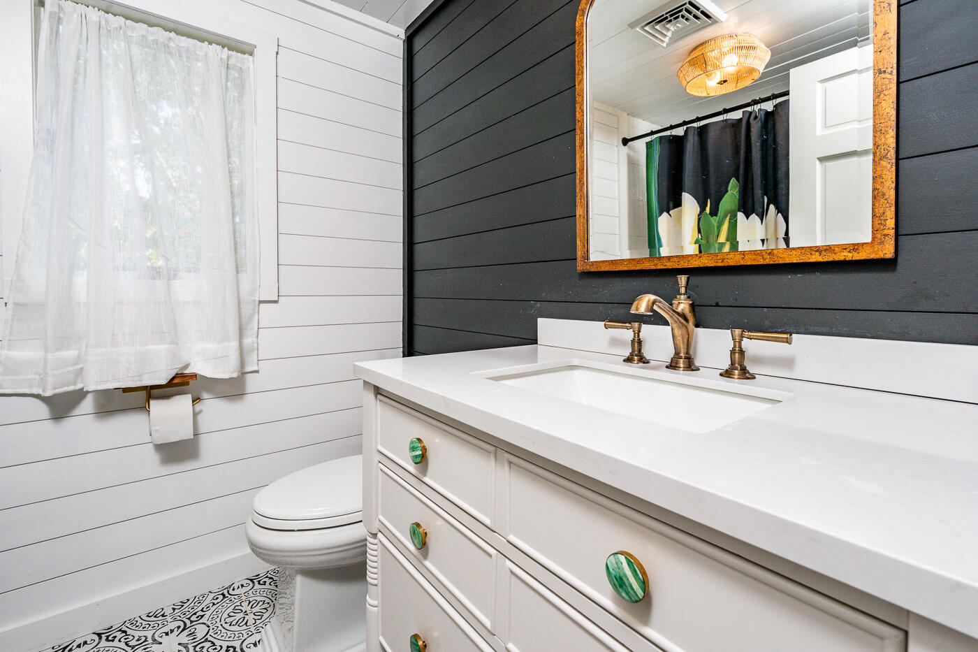 215 Gull Pond Road Wellfleet, MA 02667 - Photo 25 of 47 a bathroom with a sink a toilet and a mirror