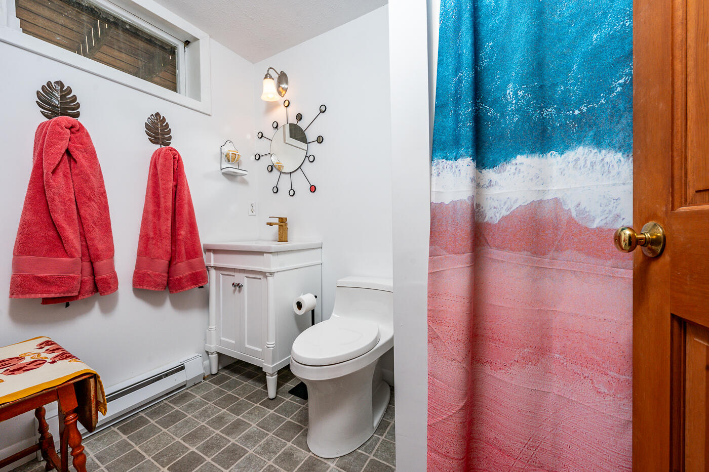 215 Gull Pond Road Wellfleet, MA 02667 - Photo 27 of 47 a bathroom with a toilet and a shower curtain