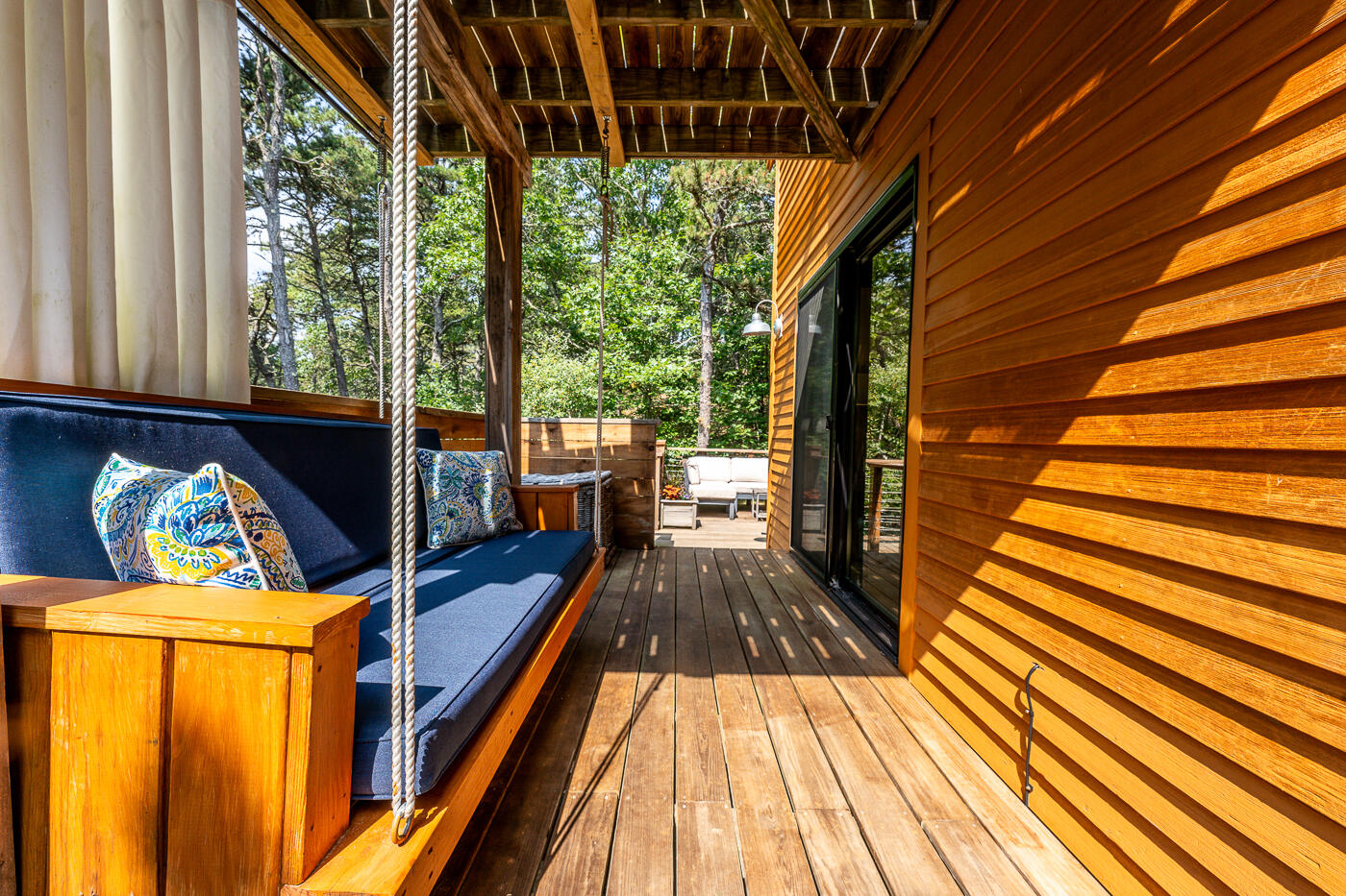 215 Gull Pond Road Wellfleet, MA 02667 - Photo 34 of 47 a view of balcony with wooden floor and outdoor seating