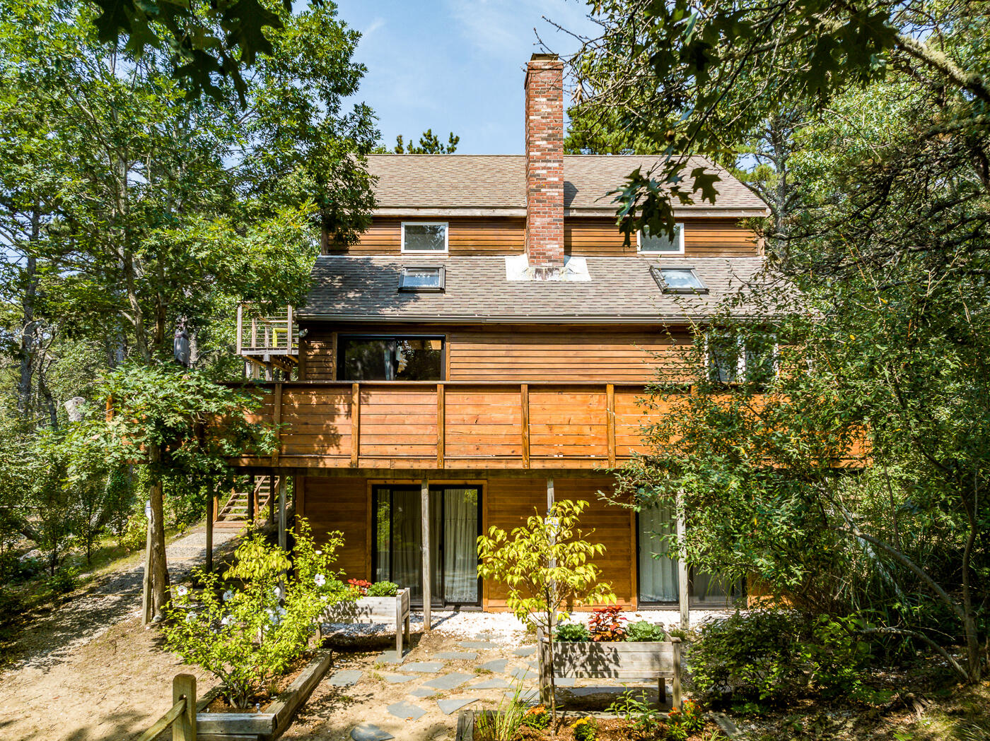 215 Gull Pond Road Wellfleet, MA 02667 - Photo 37 of 47 front view of a house with a yard