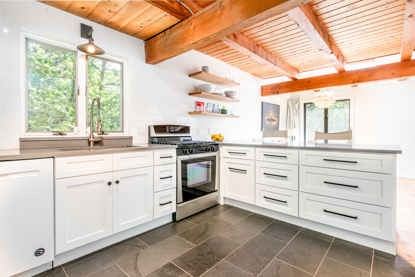 215 Gull Pond Road Wellfleet, MA 02667 - Photo 5 of 47 a kitchen with appliances cabinets and a large window