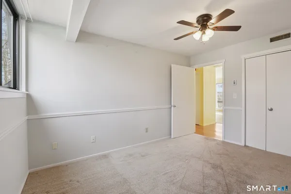 a view of a livingroom with a chandelier fan