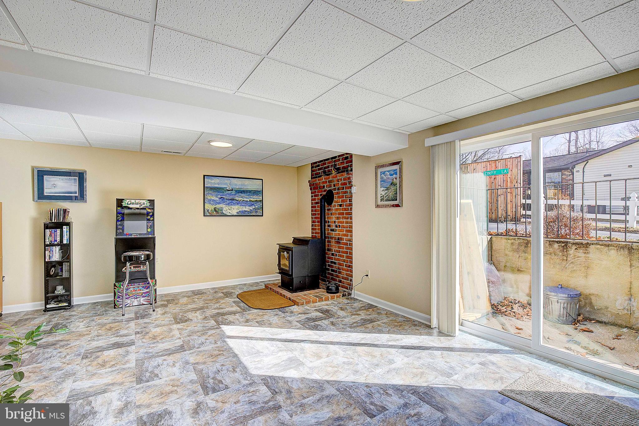 5018 Long Beach Road St. Leonard, MD 20685 - Photo 27 of 39 a view of a livingroom with wooden floor and a window