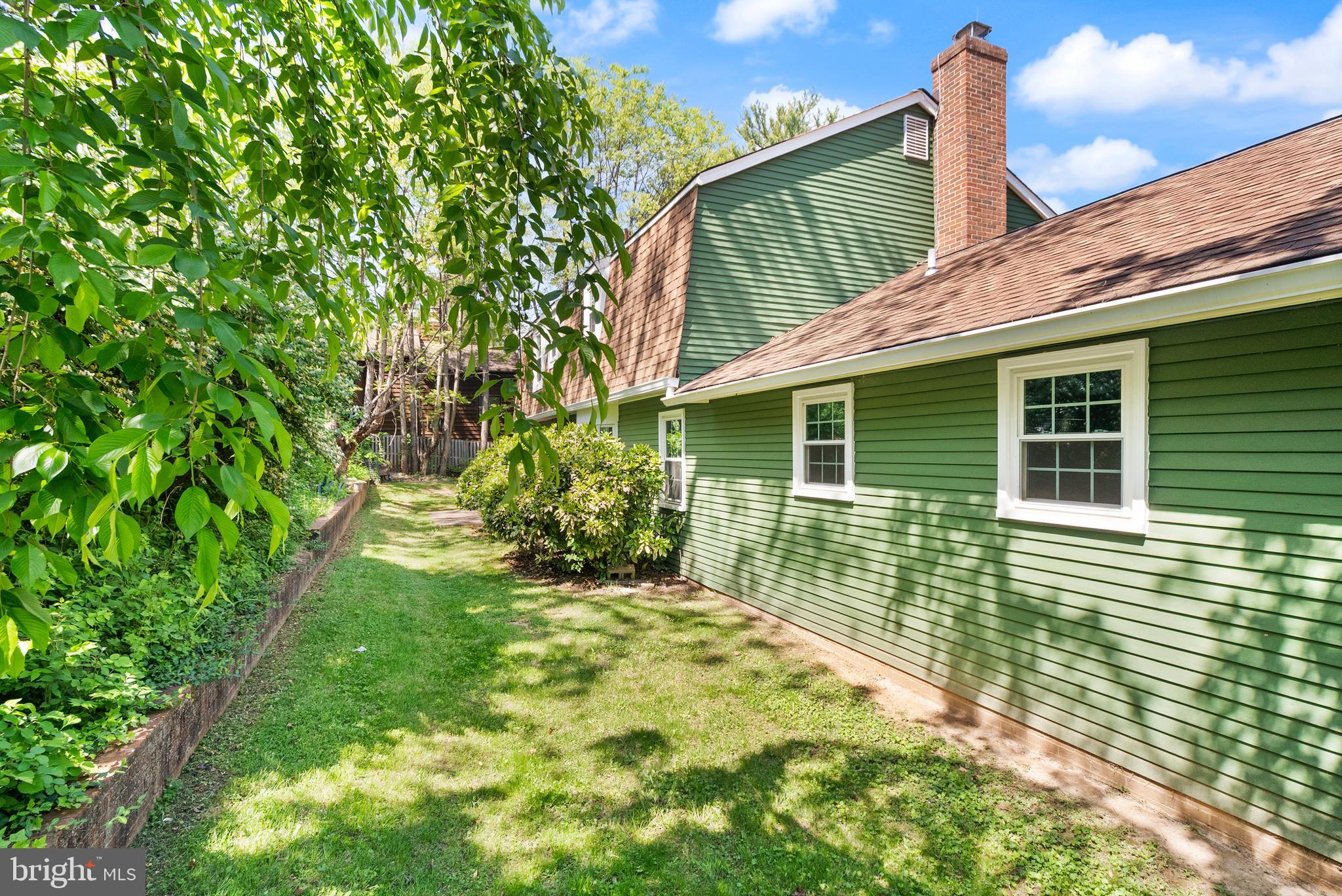 1530 Pathfinder Lane McLean, VA 22101 - Photo 8 of 22 a view of backyard with a garden and deck