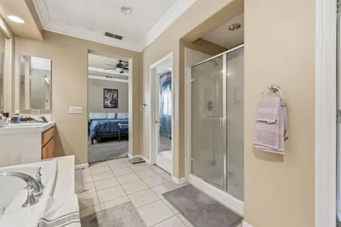 a bathroom with a tub shower and a sink