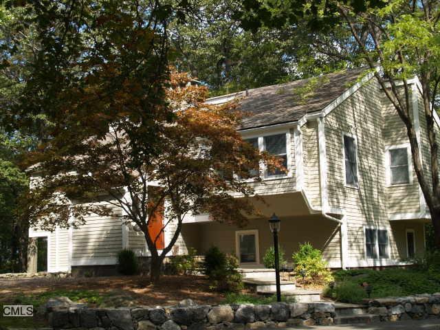 a view of house with a street