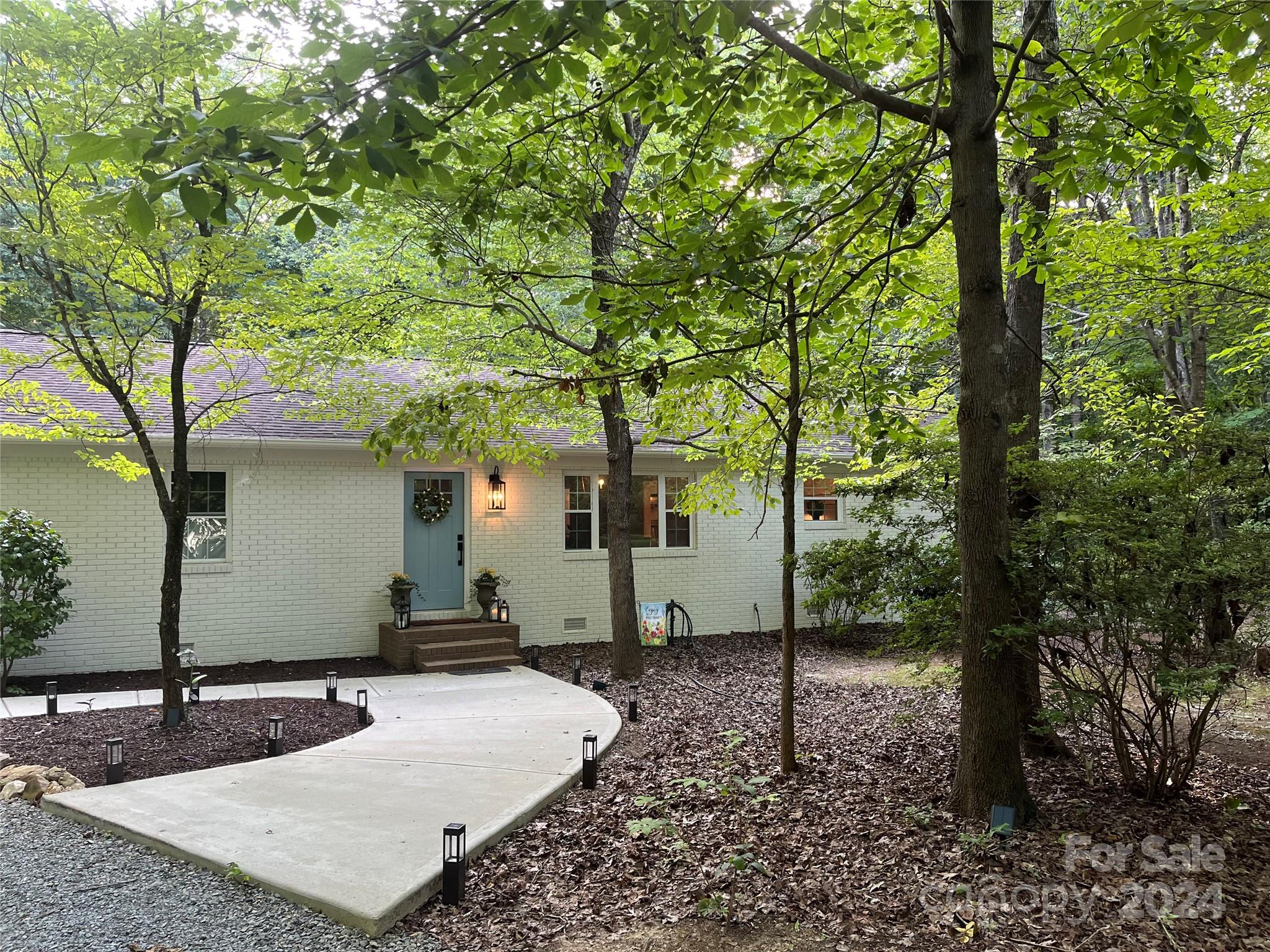 a house view with a backyard space
