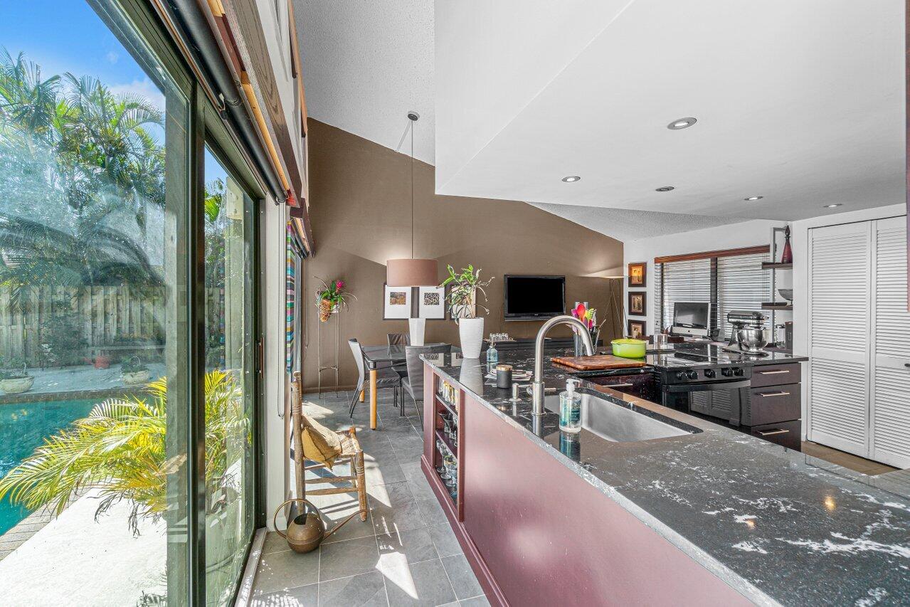 3288 Northwest 27th Avenue Boca Raton, FL 33434 - Photo 15 of 32 Kitchen & Pool