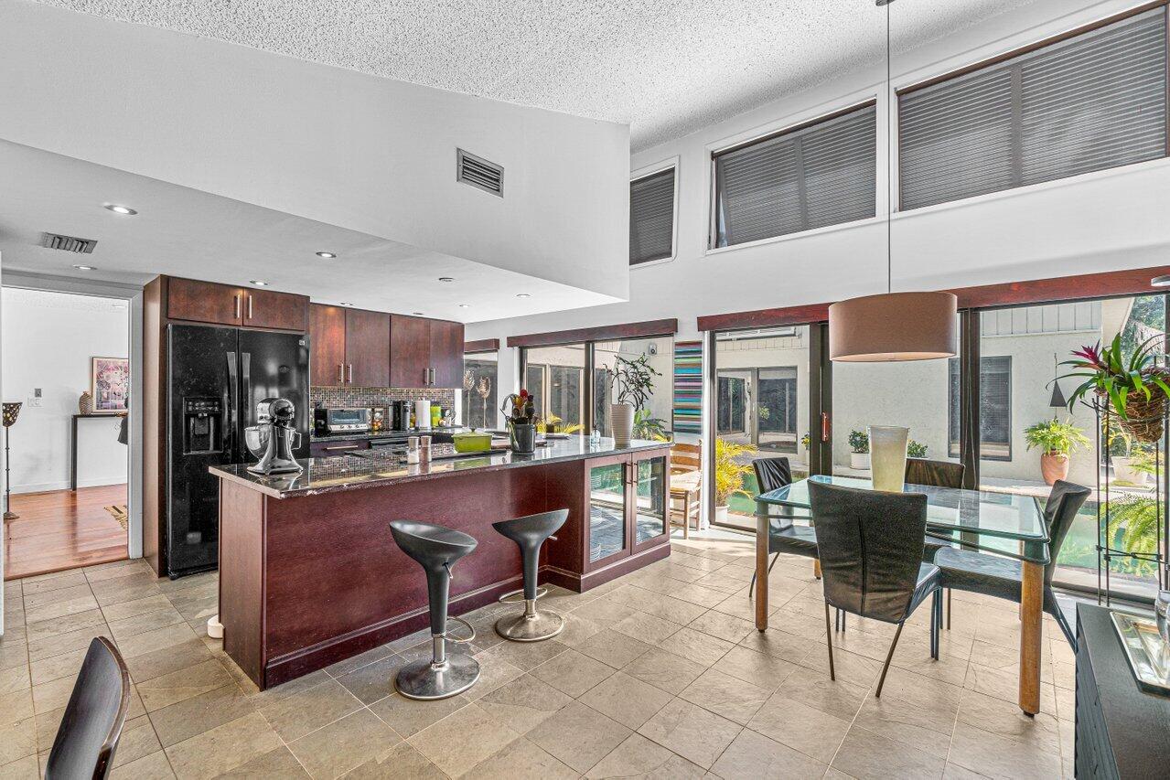 3288 Northwest 27th Avenue Boca Raton, FL 33434 - Photo 16 of 32 Kitchen & Living & Pool