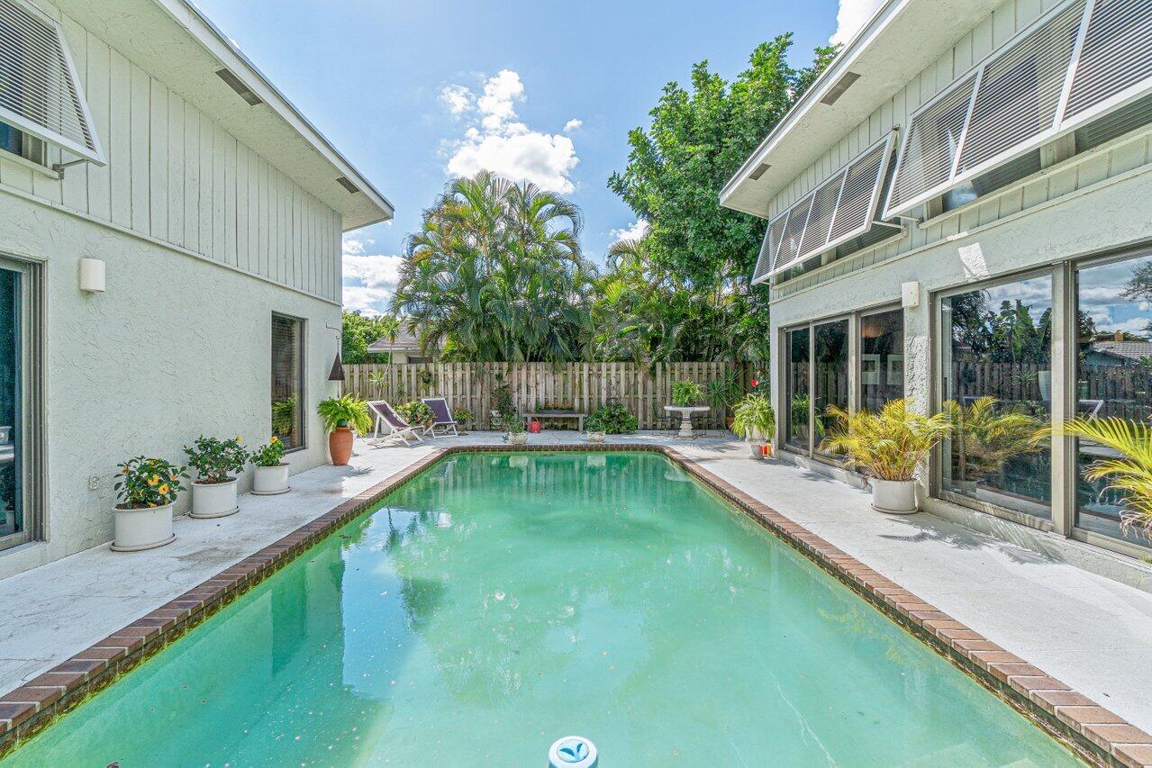 3288 Northwest 27th Avenue Boca Raton, FL 33434 - Photo 27 of 32 Courtyard Pool from Den