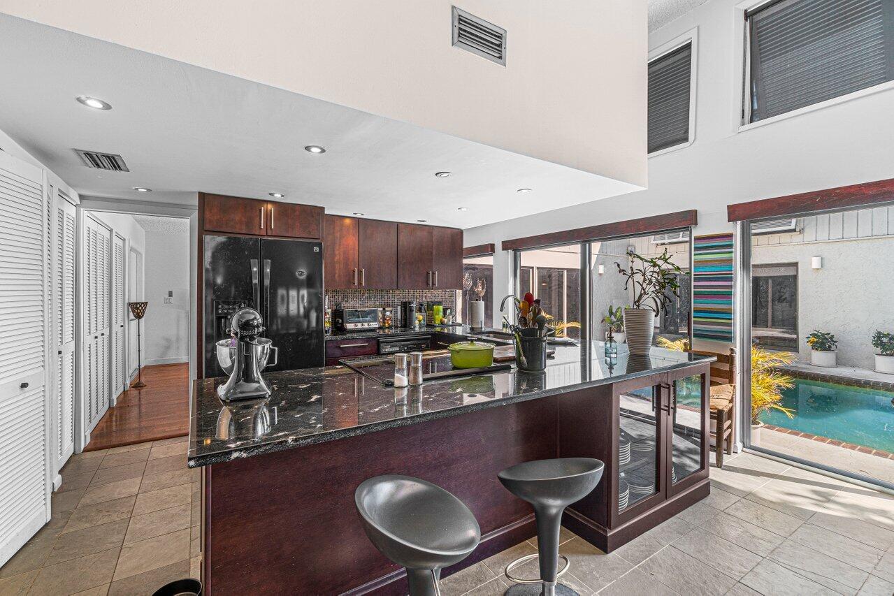 3288 Northwest 27th Avenue Boca Raton, FL 33434 - Photo 10 of 32 Kitchen to Pool