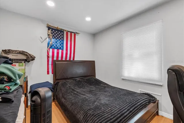 a bedroom with a bed and furniture