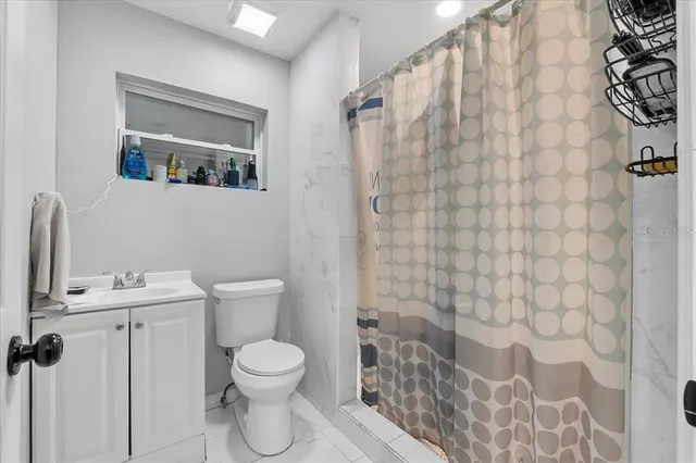 a bathroom with a toilet and a sink
