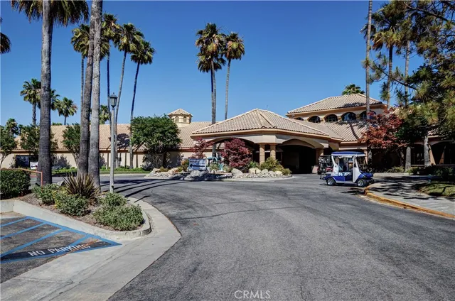 a couple of table and chairs under an umbrella
