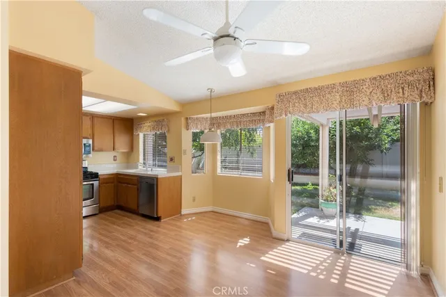 a view of a kitchen with a sink and a window