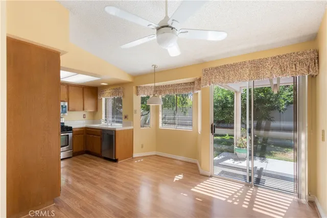 a view of a kitchen with a sink and a window