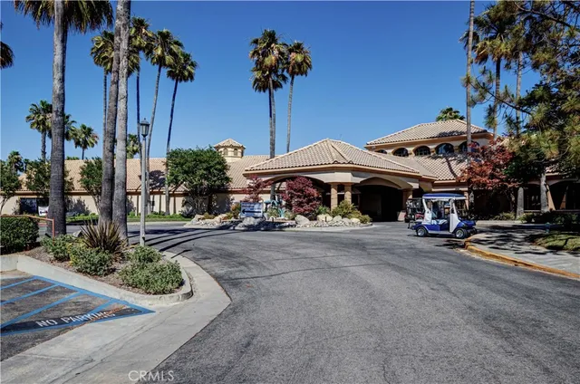 a couple of table and chairs under an umbrella