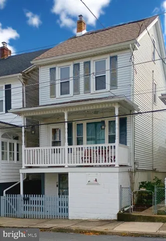 a front view of a house with a porch