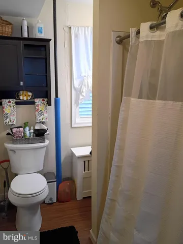 a bathroom with a toilet and a sink
