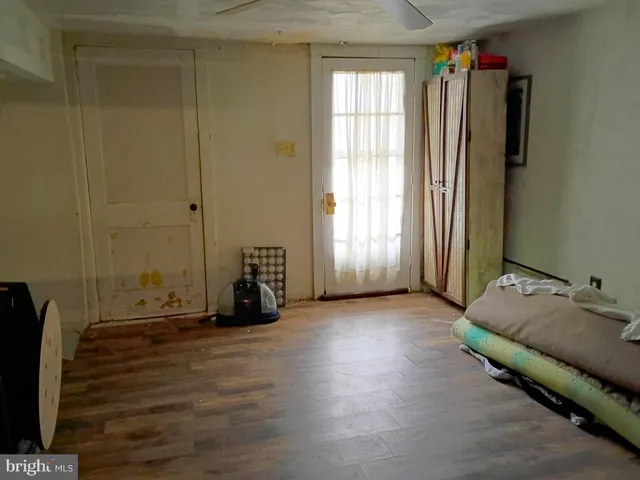 a room with a bed and a window