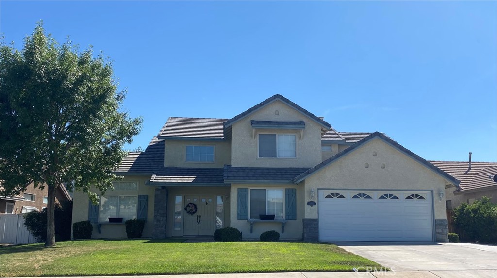 14593 Ponderosa Ranch Road Victorville, CA 92392 - Photo 1 of 1 a front view of a house with a yard
