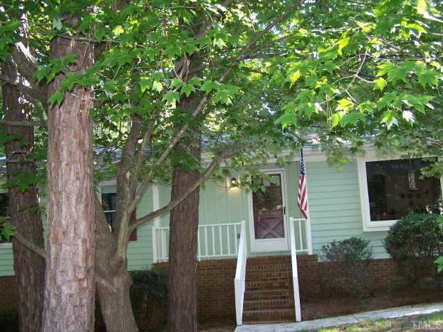 5712 Calorie Court Raleigh, NC 27612 - Photo 1 of 1 a front view of a house with a tree