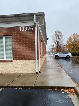 a view of outdoor space building and car parked