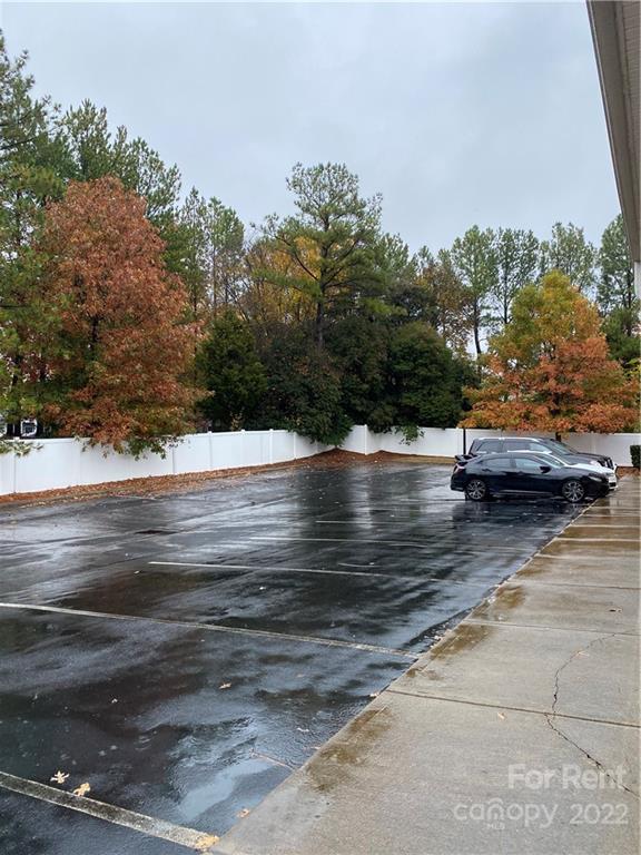 10926 South Tryon Street, Unit D Charlotte, NC 28273 - Photo 3 of 14 a view of outdoor space yard and swimming pool