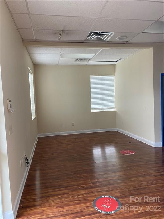 10926 South Tryon Street, Unit D Charlotte, NC 28273 - Photo 6 of 14 a view of lot of kitchen and hall with wooden floor