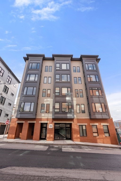 39 A Street, Unit 16 Boston, MA 02127 - Photo 13 of 14 a front view of a multi story building