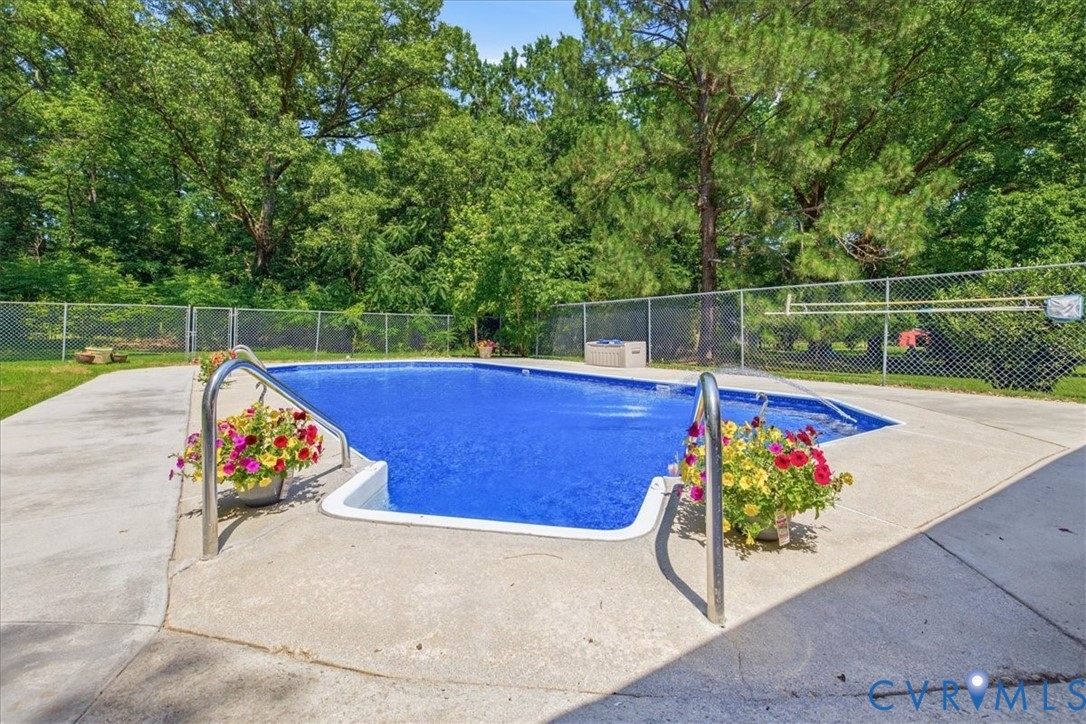 404 Bermuda Hundred Road Chester, VA 23836 - Photo 31 of 37 In-ground swimming pool with concrete surround