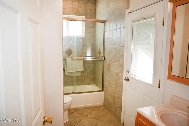 a bathroom with a tub and shower