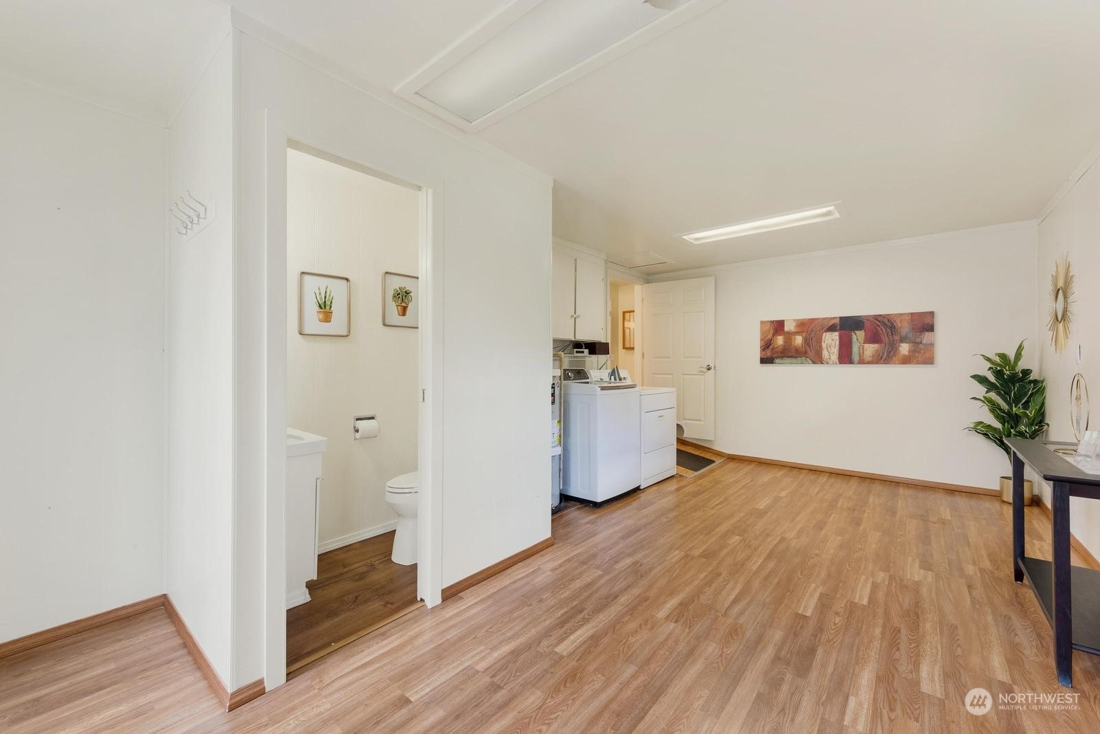 4531 Crescent Avenue Everett, WA 98203 - Photo 17 of 23 a view of a room with wooden floor and windows
