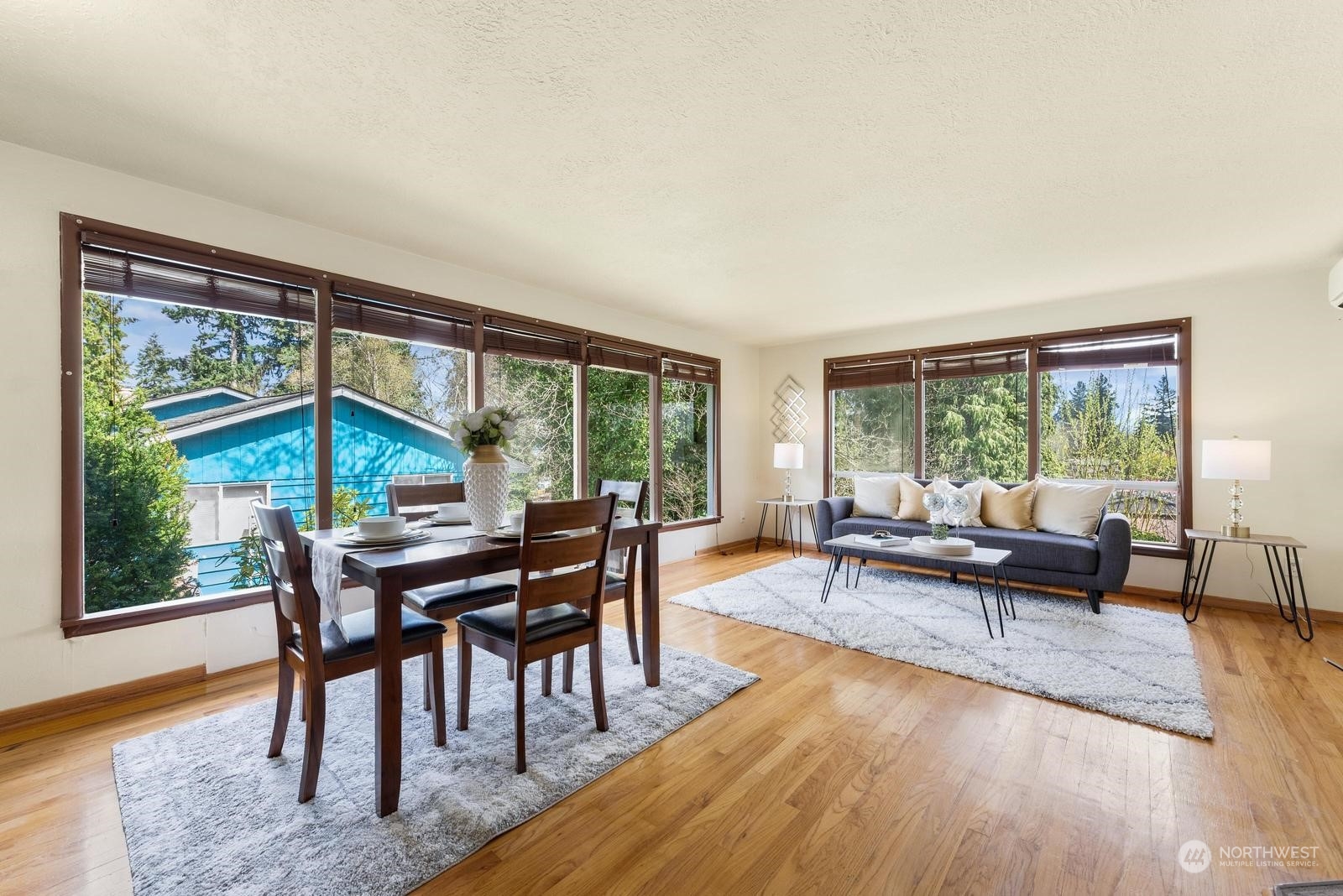 4531 Crescent Avenue Everett, WA 98203 - Photo 6 of 23 a living room with furniture a large window and wooden floor