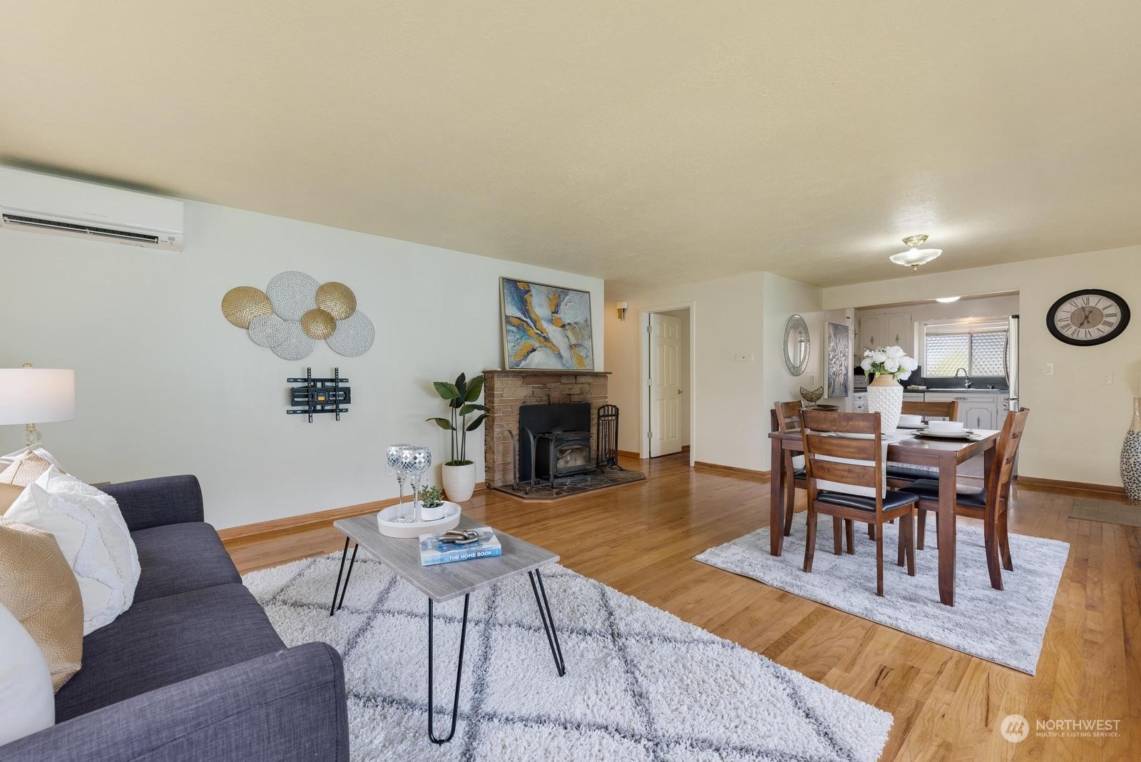 4531 Crescent Avenue Everett, WA 98203 - Photo 7 of 23 a living room with furniture a fireplace and a table