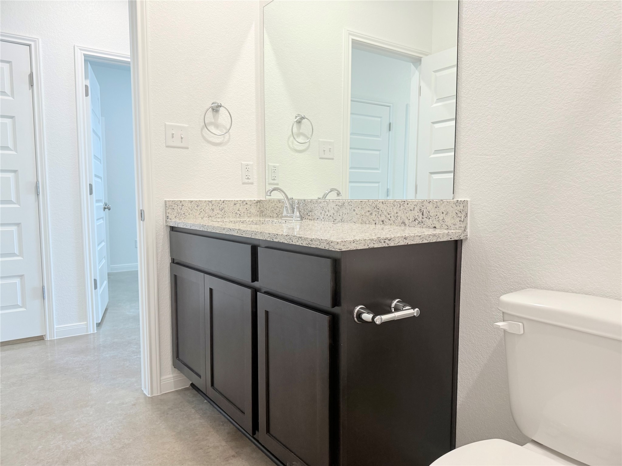 2909 Quail Rdg Lane, Unit A Temple, TX 76501 - Photo 12 of 19 Half bath featuring a textured wall and vanity