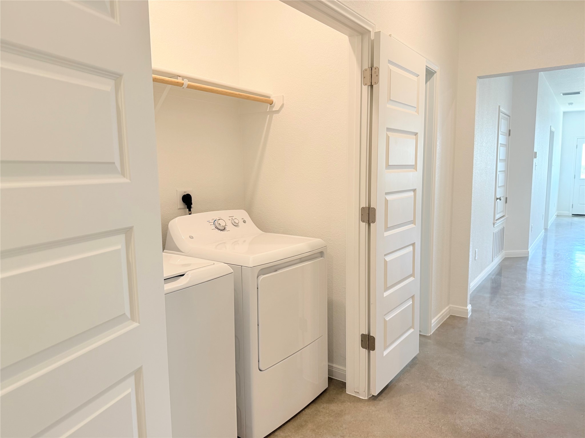 2909 Quail Rdg Lane, Unit A Temple, TX 76501 - Photo 13 of 19 Laundry area featuring concrete floors and washing machine and clothes dryer